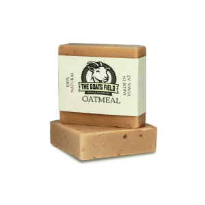 Oatmeal goat milk soap bar from The Goat's Field, featuring a natural label and creamy texture, promoting natural skincare.