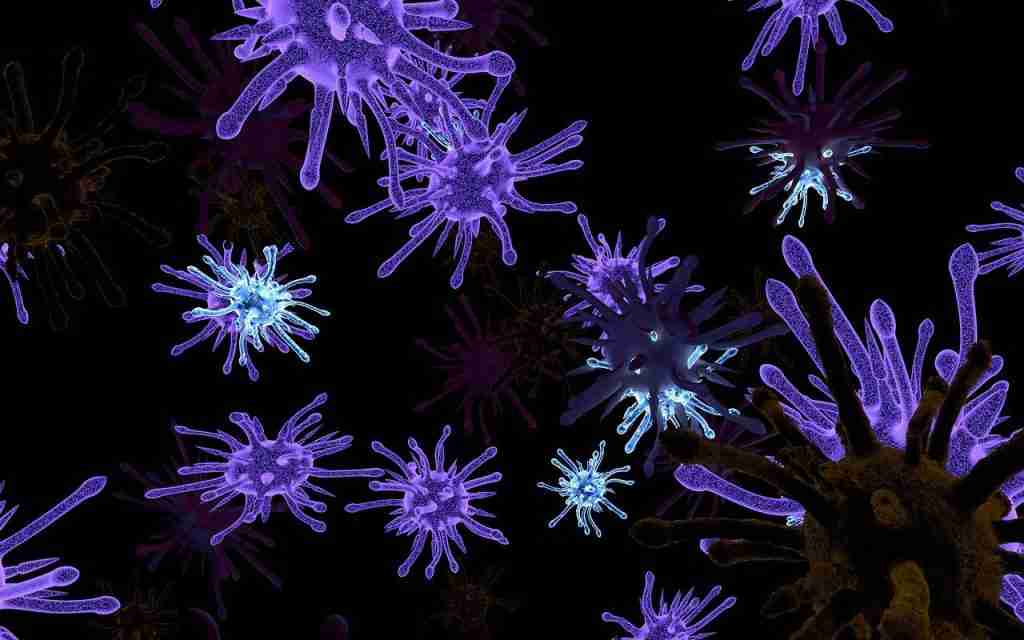 Virus particles glowing in purple and blue under dark background.
